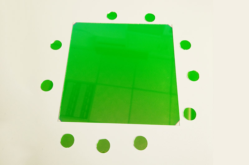 Green coated optical glass